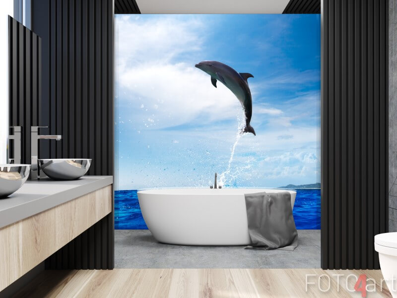 Plexiglas foto achterwand A wild dolphin jumped from shinig vibrant ocean water with beautiful seascape